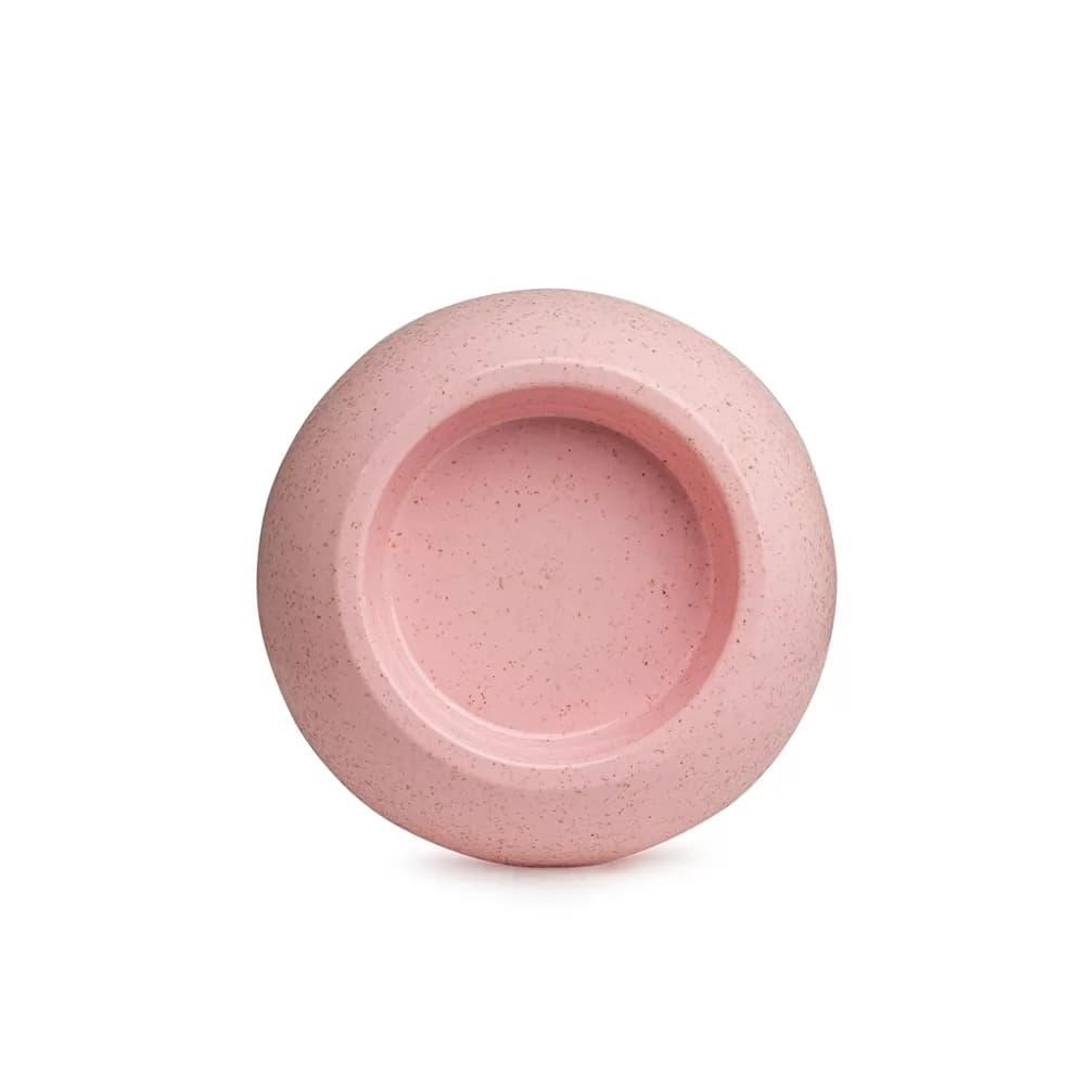 Tigela pet de fibra de arroz na cor rosa com textura pontilhada vista de cima sobre fundo branco
